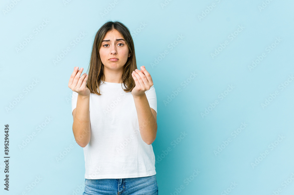 Young caucasian woman showing that she has no money. Young caucasian woman showing that she has no money.