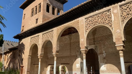 Slow tilt yp of the Partal Palace in the nasrid gardens of the Alhambra.