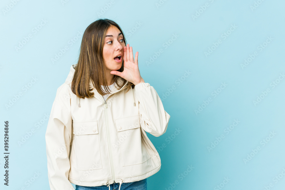 Young caucasian woman is saying a secret hot braking news and looking aside Young caucasian woman is saying a secret hot braking news and looking aside