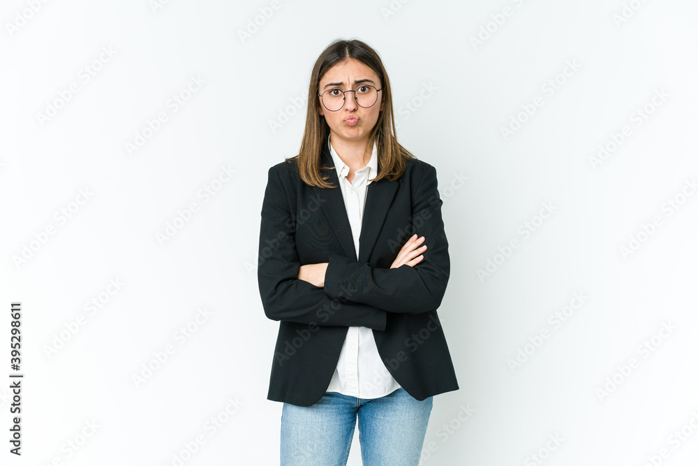 Young caucasian business woman blows cheeks, has tired expression. Facial expression concept. Young caucasian business woman blows cheeks, has tired expression. Facial expression concept.