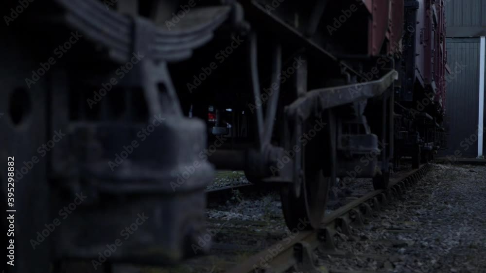 Stationary train cargo carriages on the track medium low panning shot Stationary train cargo carriages on the track medium low panning shot