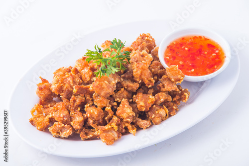 Hot and crispy fried chicken with sweet sauce.