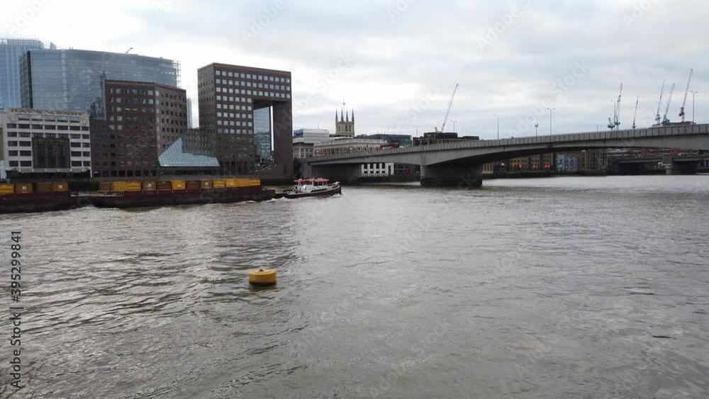 Tug boat working on river Thames in centre of London Tug boat working on river Thames in centre of London