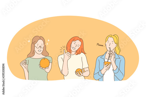 Healthy food, clean eating, vegetarian diet concept. Young positive woman eating fresh orange and drinking freshly squeezed orange juice from straw enjoying vegan diet. Wellness, healthy lifestyle 