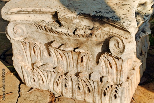 Close up of a Corinthian marble column capital at ruin ancient city of Perge, near Antaliya, Turkey. photo