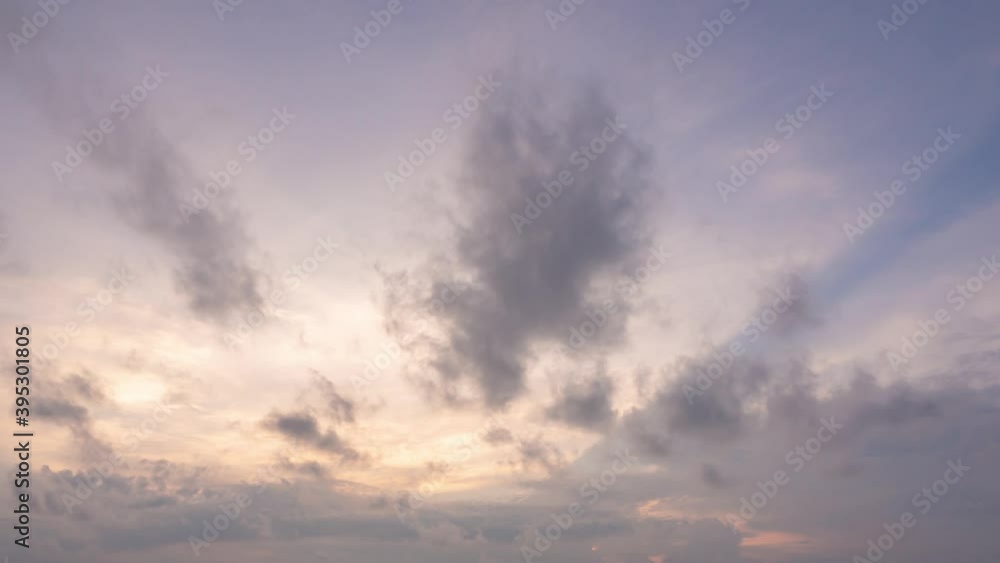 Timelapse of sunrise with abstract colourful clouds in morning sky. Warm Dawn light cover the space. Nature cloudscape landscape background 4k footage.