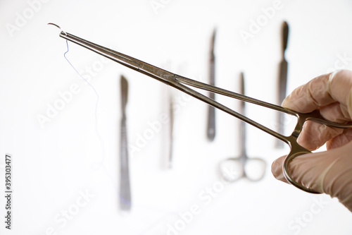 Surgery operation equipment, knife, needle and suture. Studio shoot. photo