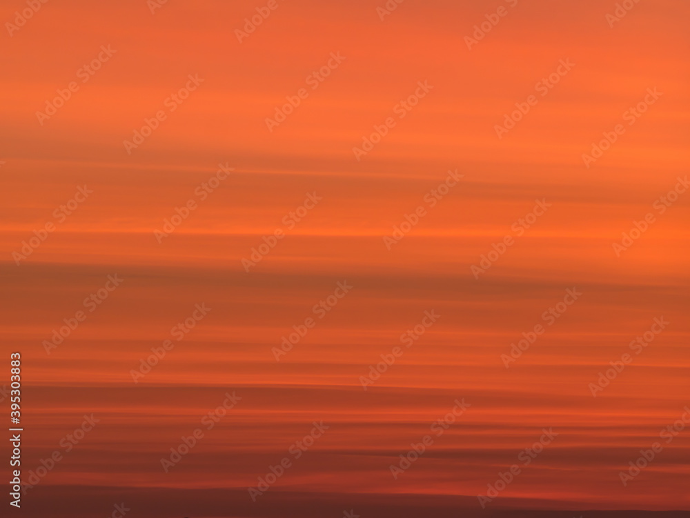 Long exposure picture with the orange sky at sunset.