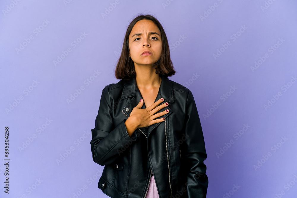 Young mixed race woman taking an oath, putting hand on chest. Young mixed race woman taking an oath, putting hand on chest.