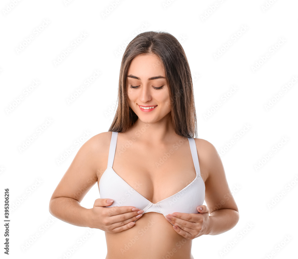 Fototapeta premium Young woman in bra on white background
