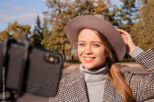 Beautiful young woman takin...