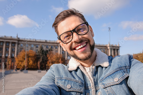 Handsome man taking selfie ...