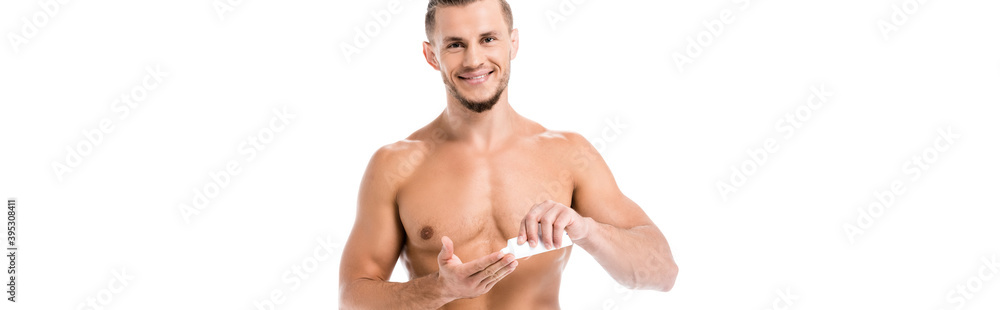 sexy shirtless man in towel applying hand cream isolated on white, banner sexy shirtless man in towel applying hand cream isolated on white, banner