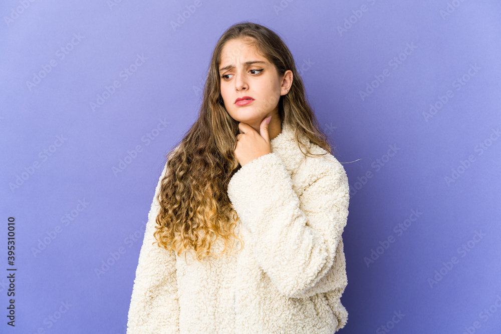 Young caucasian cute woman suffers pain in throat due a virus or infection. Young caucasian cute woman suffers pain in throat due a virus or infection.