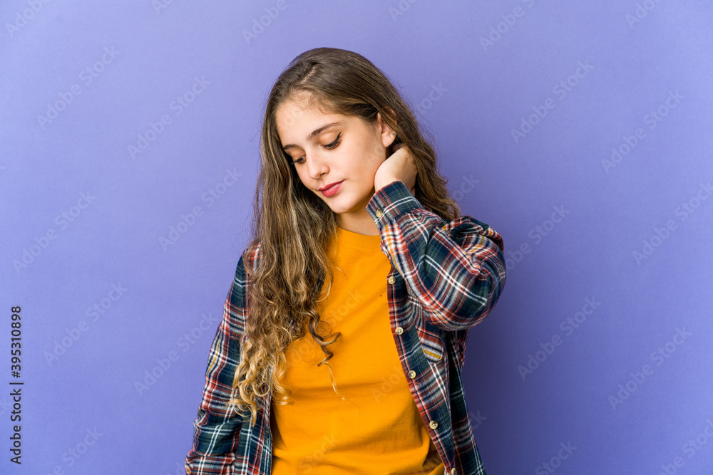 Young caucasian cute woman having a neck pain due to stress, massaging and touching it with hand. Young caucasian cute woman having a neck pain due to stress, massaging and touching it with hand.