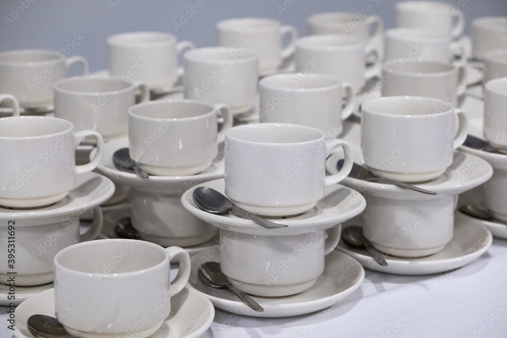 catering, many small white cups with spoons catering, many small white cups with spoons