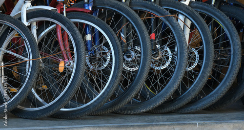 Bicycle Parking. bike shop. Bicycle repair and maintenance. Lots of Bicycle wheels.