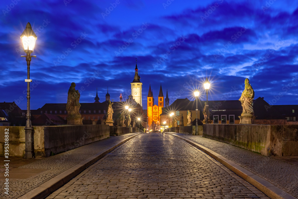 Old Main Bridge, Alte Mainbrucke with statues of saints, Cathedral and City Hall in Old Town of Wurzburg at night, Franconia, Bavaria, Germany