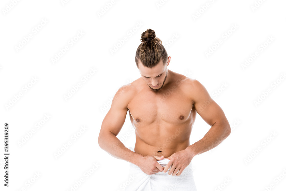 Fototapeta premium shirtless man in towel posing isolated on white