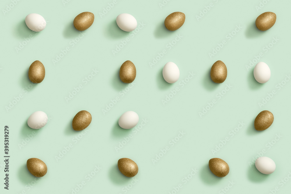 Maze of bright Easter eggs white and golden colored, creative pattern, spring holiday flat lay