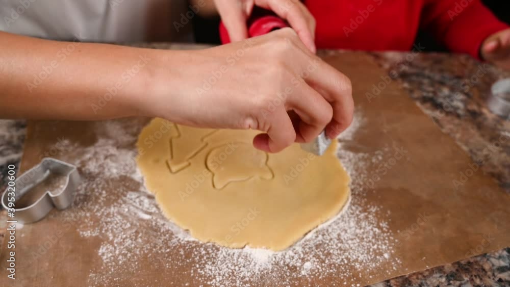 Mom and child make a mold for New Year's cookies. High quality video Mom and child make a mold for New Year's cookies. High quality video