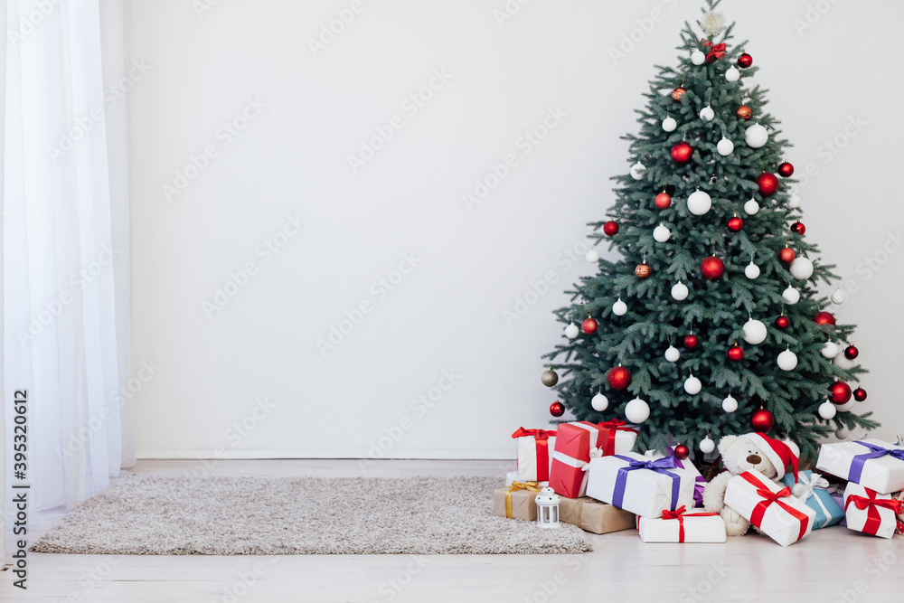 New Year's decoration Christmas tree with gifts and garlands