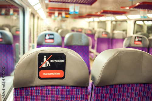 Social distancing sign on the passenger seat inside bus. Restrictions during a pandemic of coronavirus