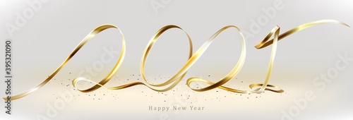 New year's logo 2021 made of gold ribbon. New year's sign with a gold ribbon.
