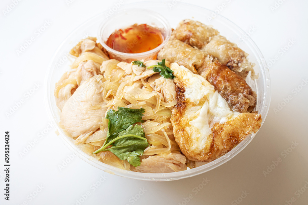 Delicious Vietnamese Bo Bun prepared with rice vermicelli noodles for basics and for topping chicken pieces and fried spring rolls Delicious Vietnamese Bo Bun prepared with rice vermicelli noodles for basics and for topping chicken pieces and fried spring rolls