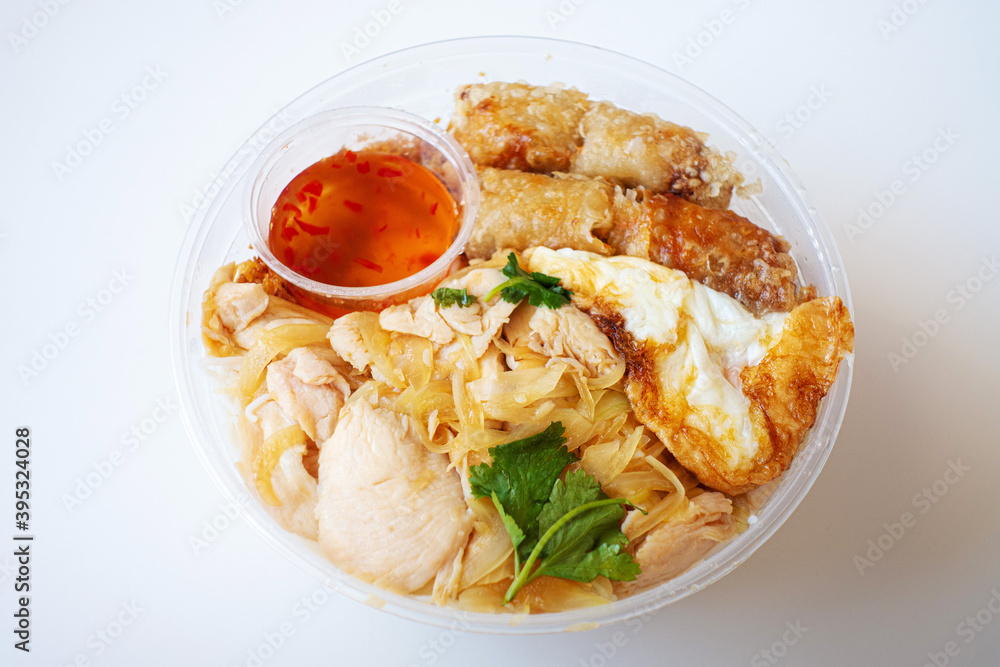 Delicious Vietnamese Bo Bun prepared with rice vermicelli noodles for basics and for topping chicken pieces and fried spring rolls Delicious Vietnamese Bo Bun prepared with rice vermicelli noodles for basics and for topping chicken pieces and fried spring rolls