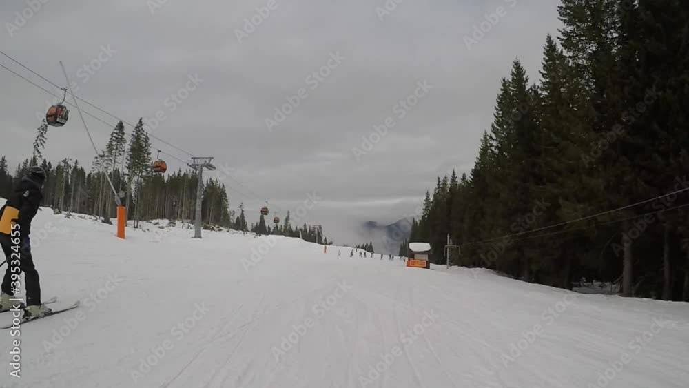 skiing. ski resort. winter vacation, weekends holidays, snow-capped mountains in fog. subjective dynamic camera. unrecognizable people. Slovakia Jasna. FullHD footage.