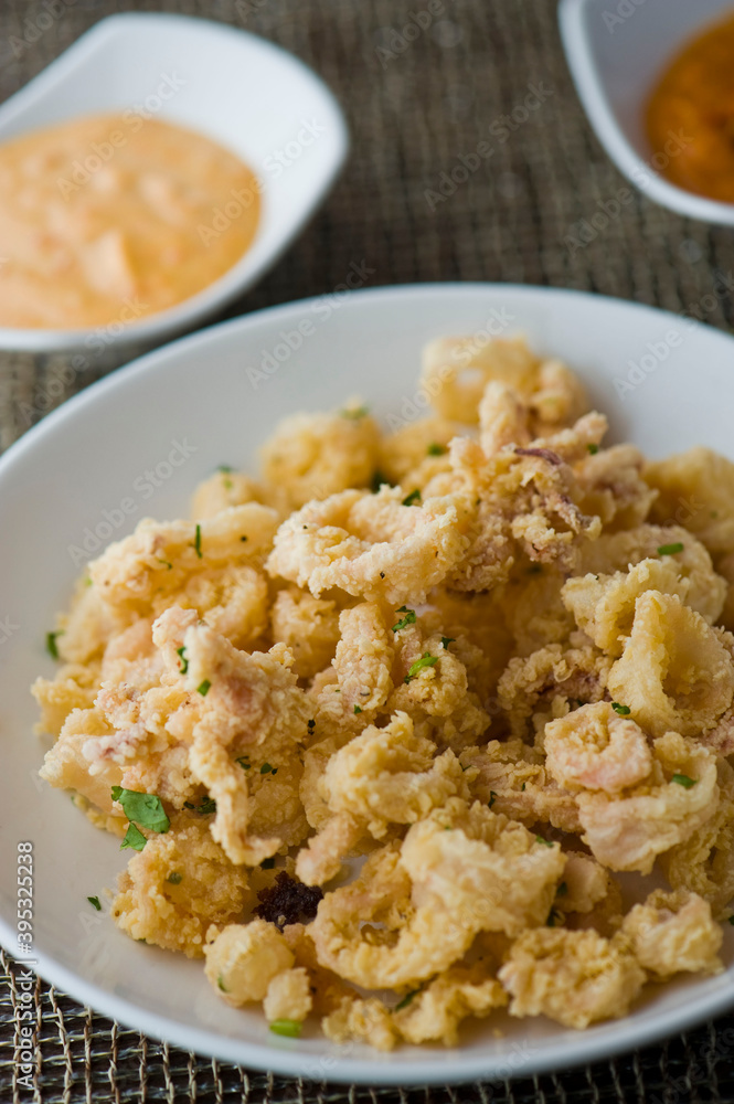 Calamari served with spicy and sweet dipping sauces. Classic American restaurant or French bistro appetizer favorite. Fresh octopus, squid and shrimp battered and deposed fried. Calamari served with spicy and sweet dipping sauces. Classic American restaurant or French bistro appetizer favorite. Fresh octopus, squid and shrimp battered and deposed fried.
