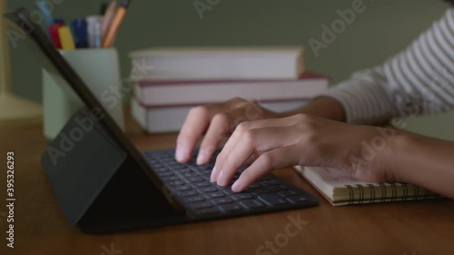Wallpaper Mural Close up Hand woman using tablet digital on desk typing work at home, night Torontodigital.ca
