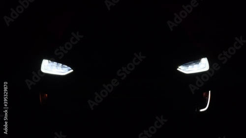 Car working lights. 4K video. flashing turns, The Bright Future of Electric Cars: A Demonstration of the Headlights in Action
