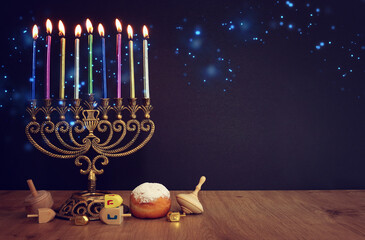 Religion image of jewish holiday Hanukkah background with menorah (traditional candelabra) and candles