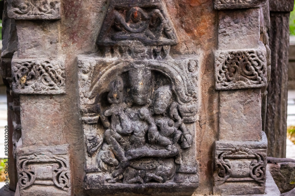 Stone carvings on the walls of an ancient Hindu temple