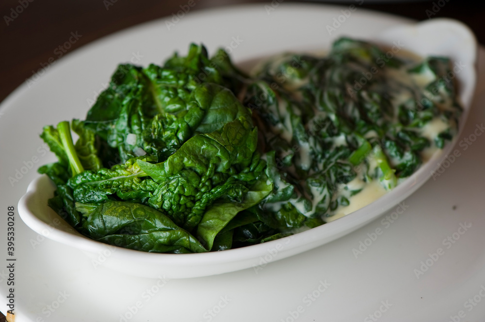 Creamed spinach roasted in garlic, onions, olive oil and fresh herbs and spices. Classic American steakhouse or French bistro appetizer or side dish. Creamed spinach roasted in garlic, onions, olive oil and fresh herbs and spices. Classic American steakhouse or French bistro appetizer or side dish.