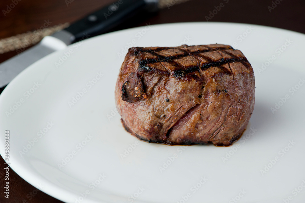 Steak and potatoes. Grade A grass fed angus beef steaks. Tenderloin, filet mignon, New York strip, bone in rib-eye grilled medium rare on outdoor wood-fired grill. Classic American steakhouse entree. Steak and potatoes. Grade A grass fed angus beef steaks. Tenderloin, filet mignon, New York strip, bone in rib-eye grilled medium rare on outdoor wood-fired grill. Classic American steakhouse entree.