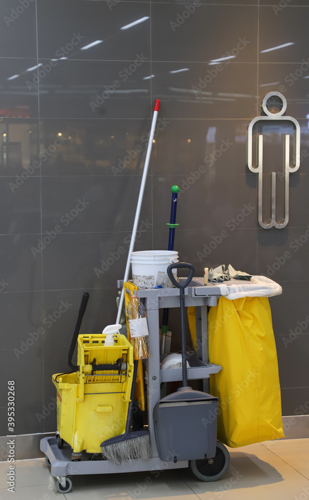Closeup of janitorial, cleaning equipment and tools. Vertical view. Closeup of janitorial, cleaning equipment and tools. Vertical view.