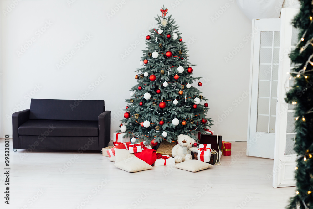Christmas tree decor pine with gifts and garlands interior new year