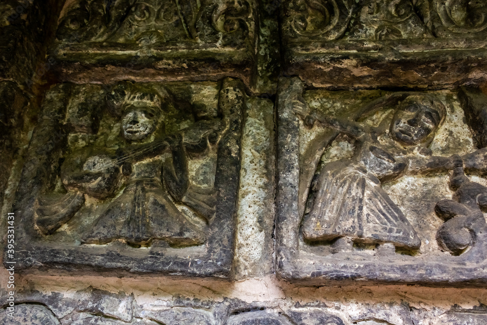 Ancient stone carvings on the walls of a HIndu temple