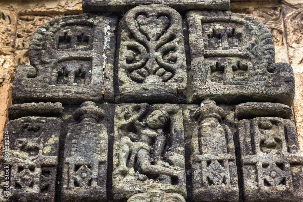 Ancient stone carvings on the walls of a HIndu temple