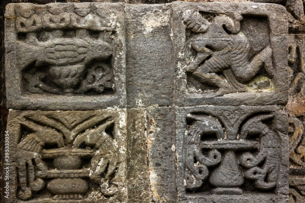 Stone carvings on the walls of an ancient Hindu temple