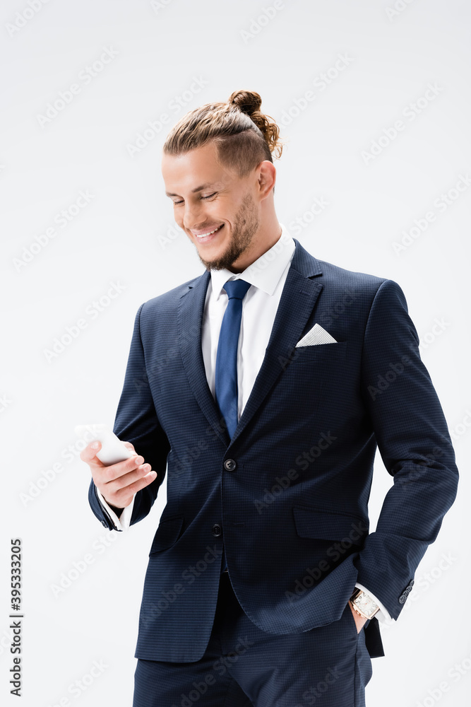 young businessman in suit with smartphone isolated on white young businessman in suit with smartphone isolated on white