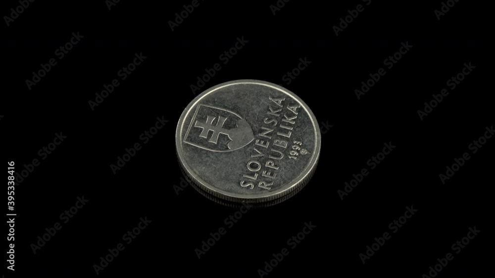 5 sk coin from Republic of Slovenia on a black background 5 sk coin from Republic of Slovenia on a black background