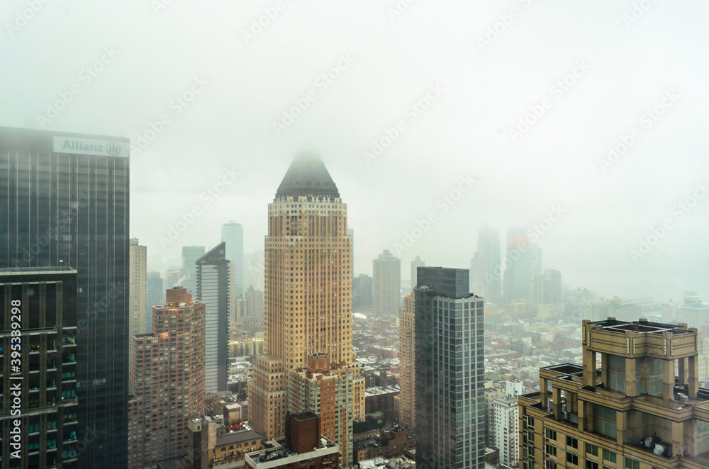 Obraz premium Buildings, Skyscrapers and Towers in Manhattan on a Foggy Day of Winter. Aerial View of New York City, USA
