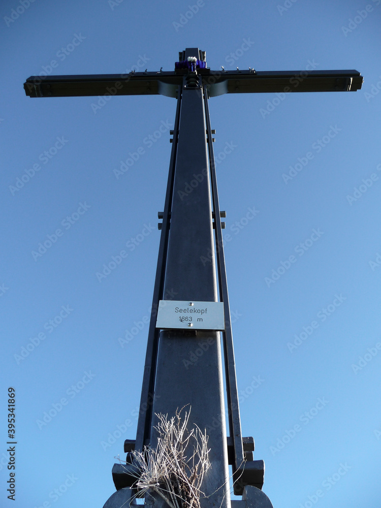 Summit cross of Seelekopf mountain at panorama hiking tour Nagelfluhkette, Bavaria, Germany Summit cross of Seelekopf mountain at panorama hiking tour Nagelfluhkette, Bavaria, Germany