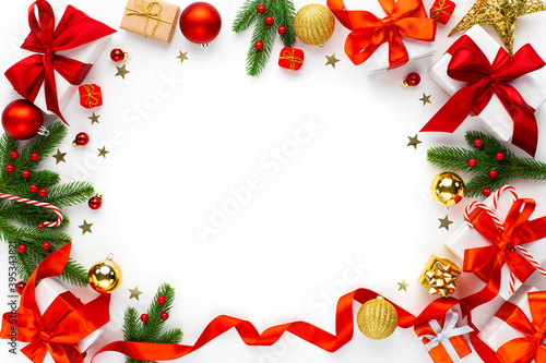 Christmas background with red decorations, baubles, fir tree branches, gift boxes © dragonstock