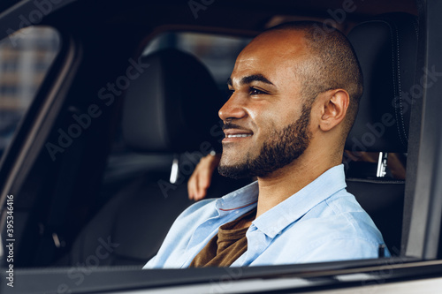 African american male driver sitting in a car © fotofabrika