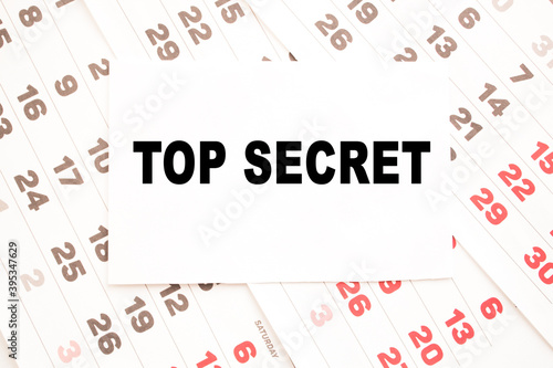 text TOP SECRET on a sheet from Notepad.a digital background. business concept . business and Finance.